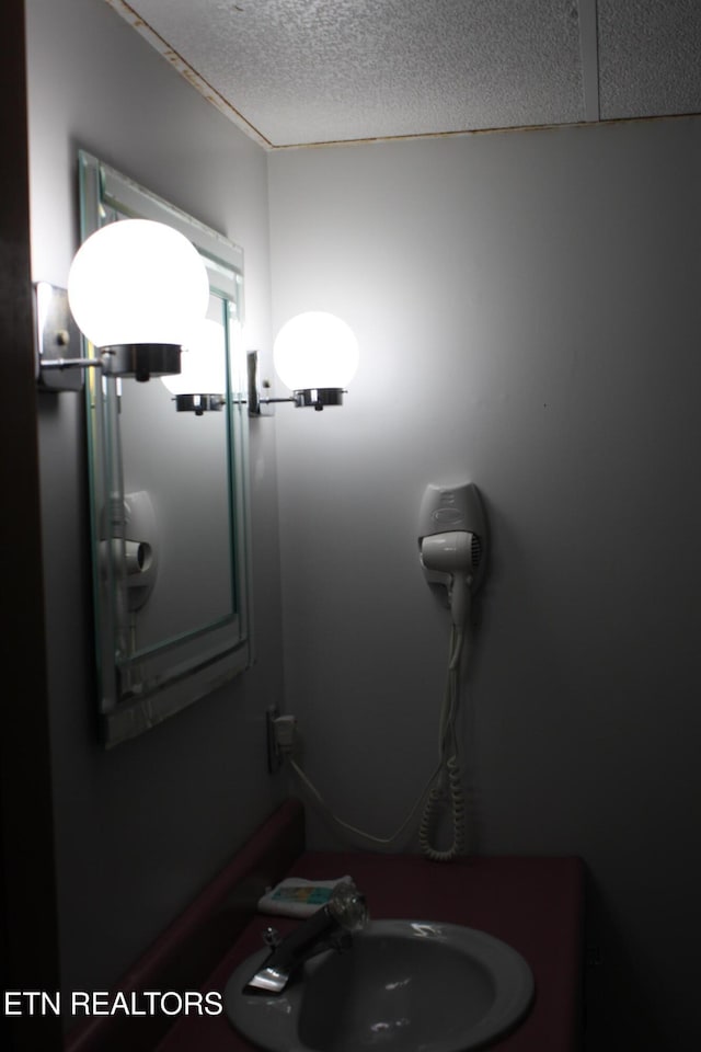 interior space with sink and a textured ceiling