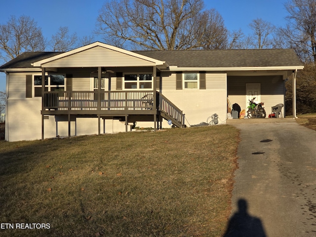 single story home featuring a porch and a front yard