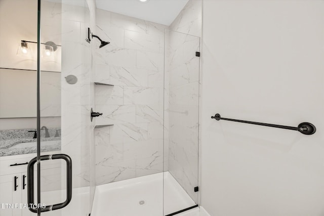 bathroom featuring a shower with shower door