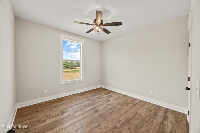 unfurnished room with hardwood / wood-style floors and ceiling fan