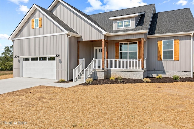 view of front of home featuring a garage and covered porch