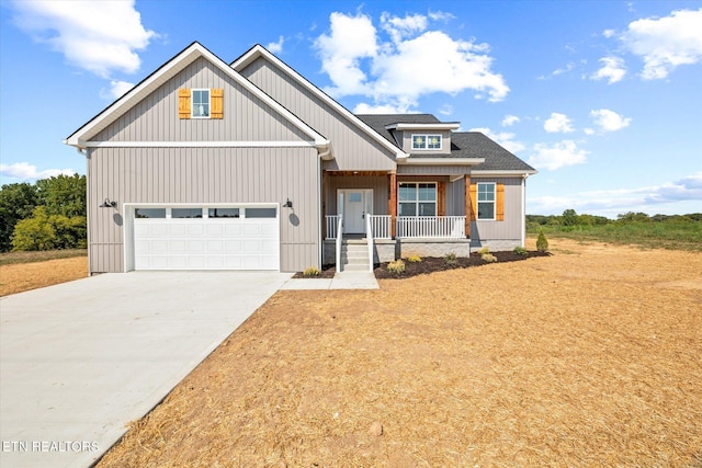 view of front of property featuring a porch and a garage