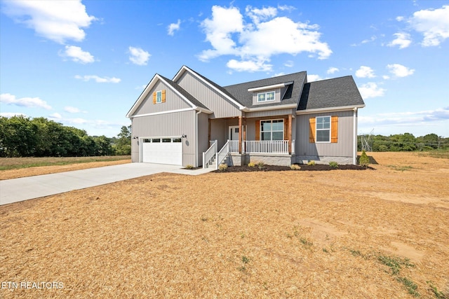 craftsman inspired home featuring a porch and a garage