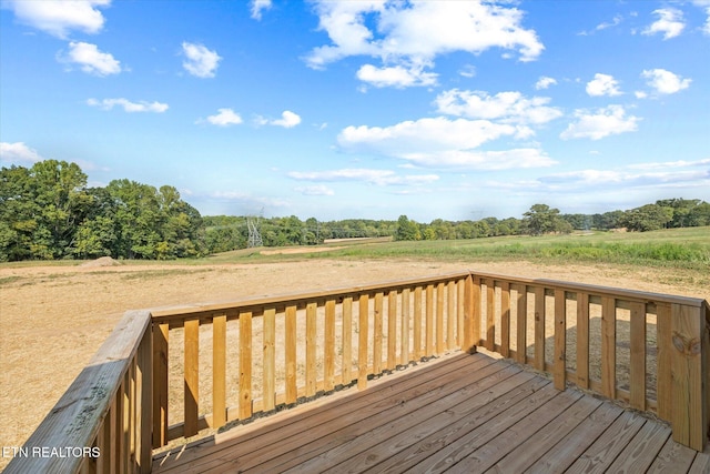 wooden deck featuring a rural view