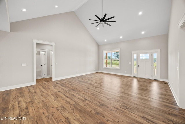 unfurnished living room featuring ceiling fan, hardwood / wood-style floors, and high vaulted ceiling