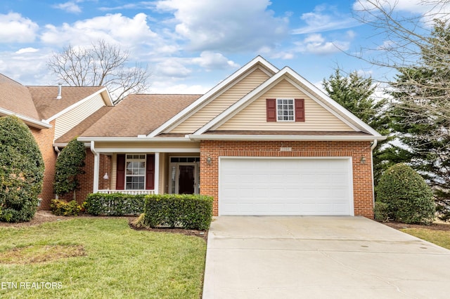 view of front of property featuring a garage and a front yard