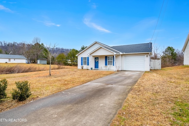 ranch-style house with a garage and a front lawn