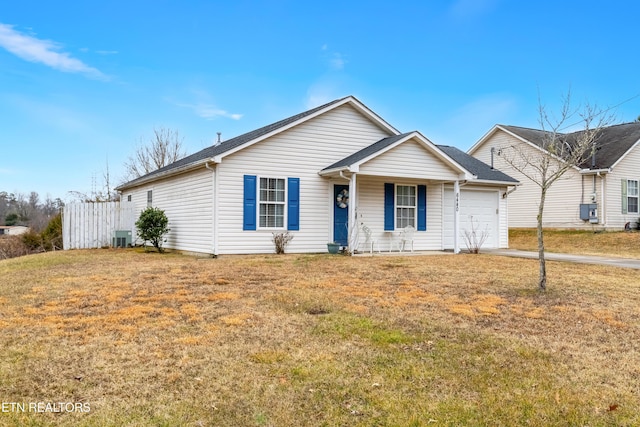 ranch-style home with a garage, central AC, and a front yard