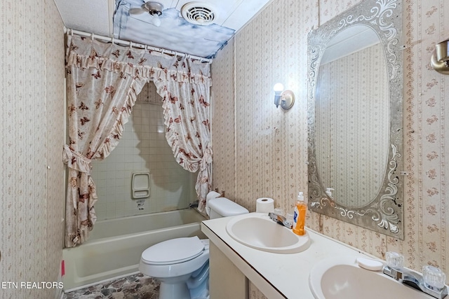 full bathroom featuring shower / bath combination with curtain, vanity, and toilet