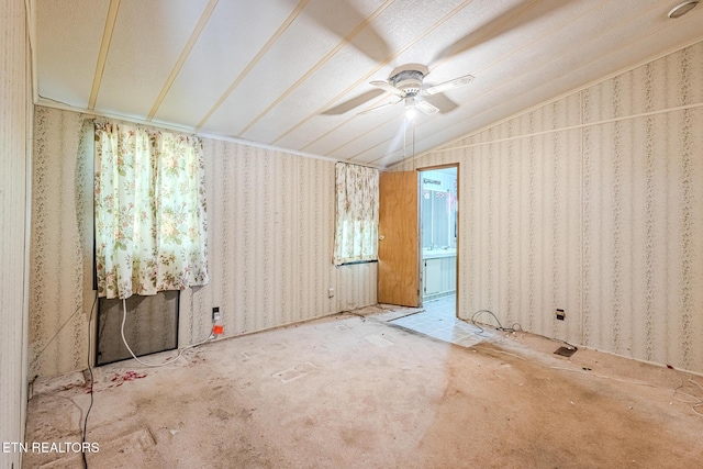 spare room with vaulted ceiling and ceiling fan