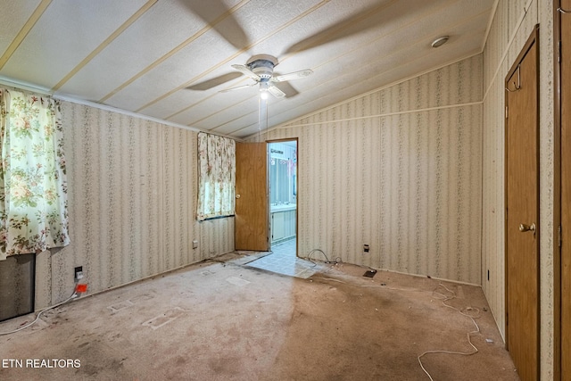 unfurnished bedroom with vaulted ceiling and ceiling fan