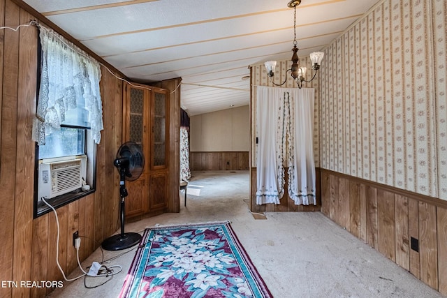 interior space with cooling unit, a notable chandelier, and wooden walls