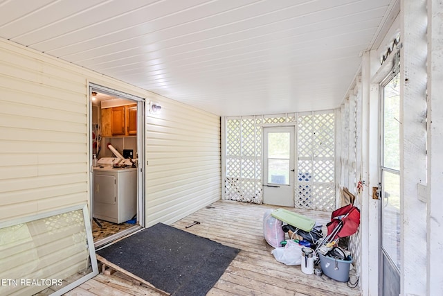 sunroom / solarium featuring washer and dryer