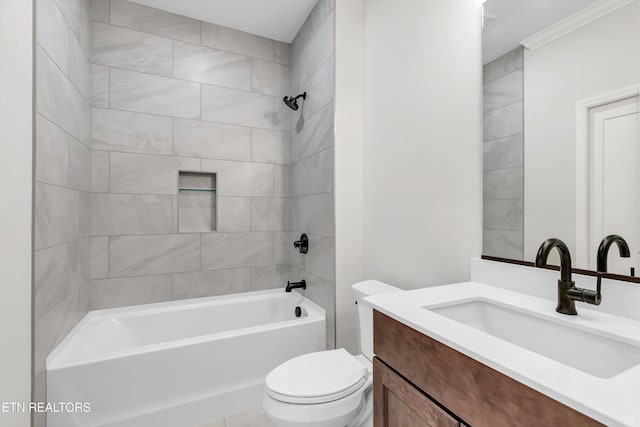 full bathroom with vanity, tiled shower / bath combo, ornamental molding, and toilet