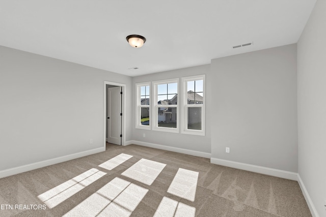 view of carpeted spare room