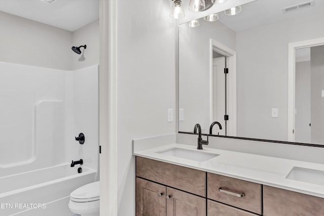 full bathroom with vanity, shower / bathtub combination, and toilet