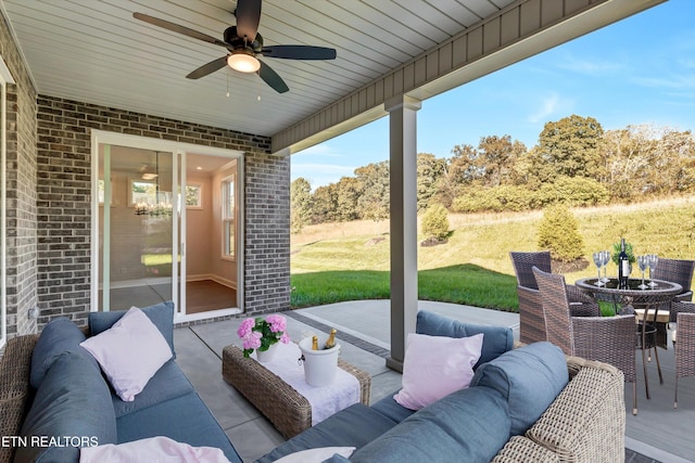 view of patio / terrace with an outdoor living space and ceiling fan