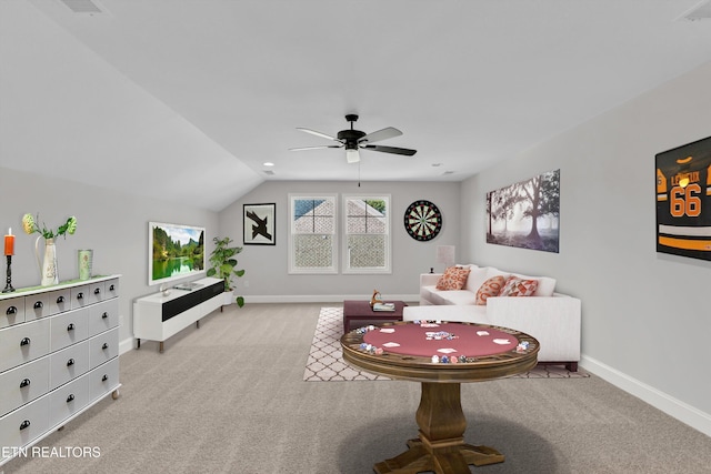 living room with ceiling fan, light colored carpet, and lofted ceiling