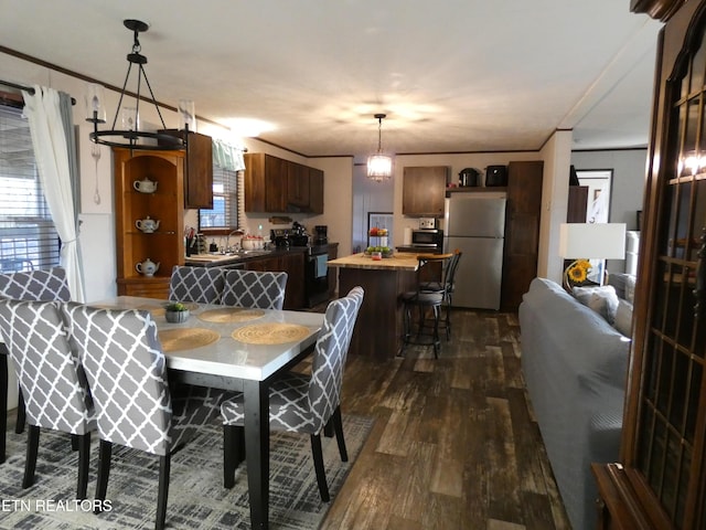 dining area featuring dark hardwood / wood-style flooring