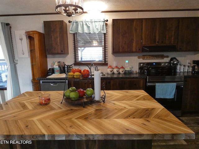 kitchen featuring appliances with stainless steel finishes, dark brown cabinets, ventilation hood, ornamental molding, and parquet floors