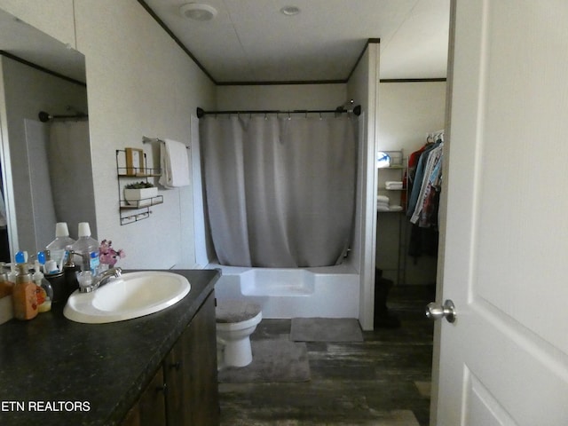 full bathroom featuring shower / tub combo with curtain, vanity, and toilet