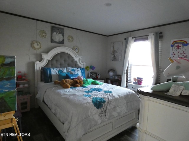bedroom featuring crown molding
