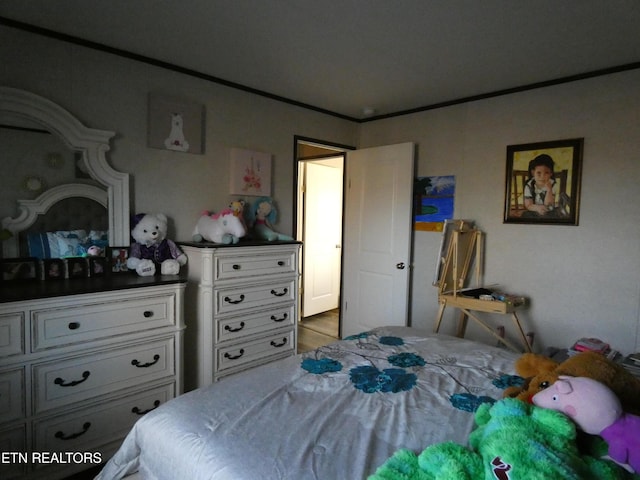 bedroom with crown molding