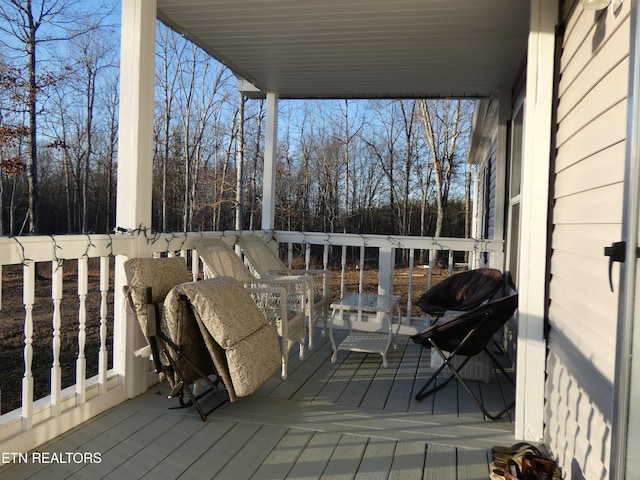 wooden deck with a grill