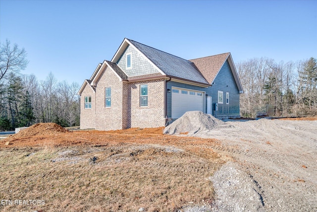 view of property exterior featuring a garage