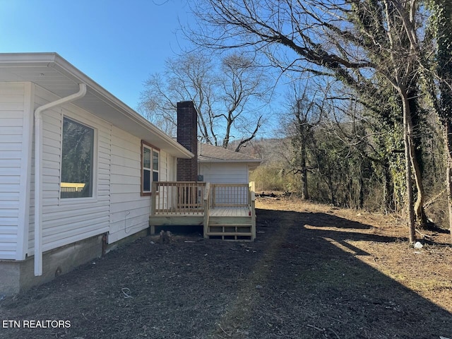 view of yard with a wooden deck