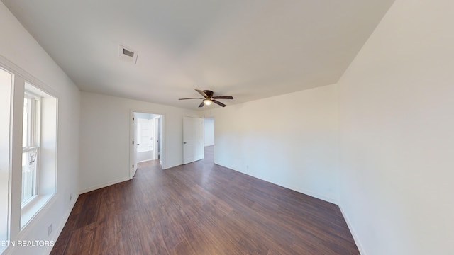 spare room featuring dark hardwood / wood-style floors and ceiling fan