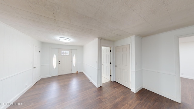 foyer entrance with dark hardwood / wood-style floors