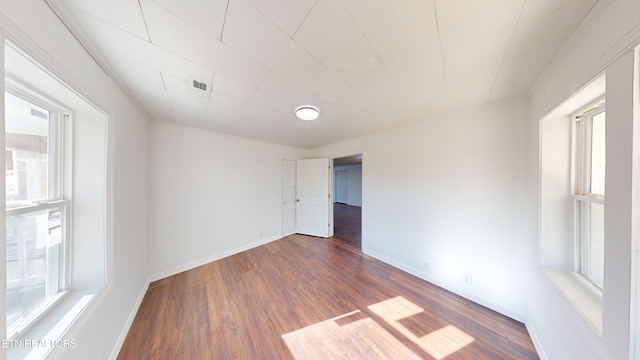 empty room featuring dark hardwood / wood-style floors