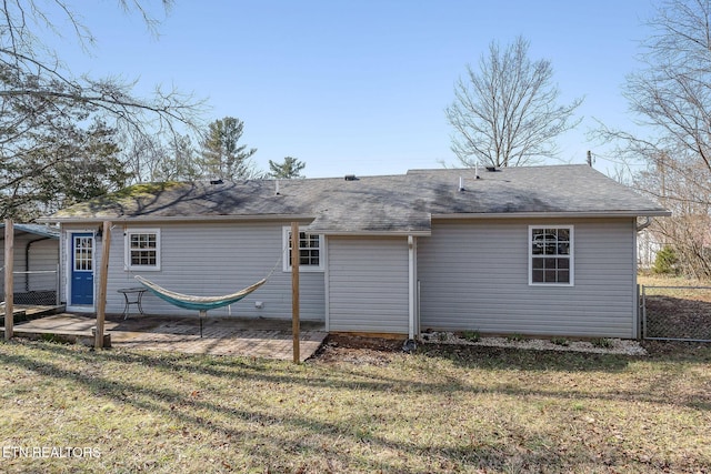 back of property featuring a carport, a yard, and a patio