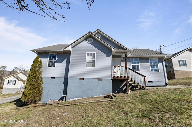 rear view of house with a yard