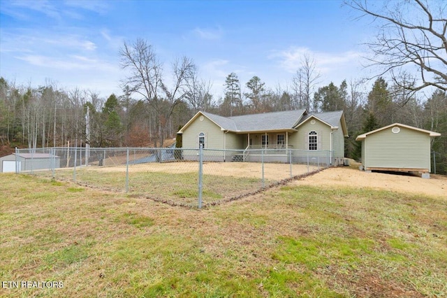 exterior space featuring a storage shed and a lawn