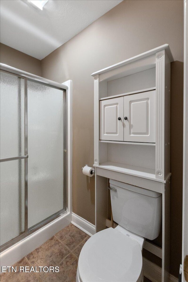 142 Wagon Wheel Ln, Pioneer, TN 37847 - bathroom with a stall shower and tile patterned flooring
