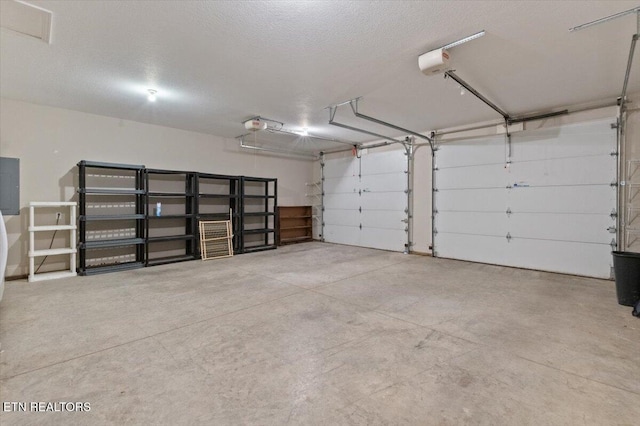 142 Wagon Wheel Ln, Pioneer, TN 37847 - garage with a garage door opener and electric panel