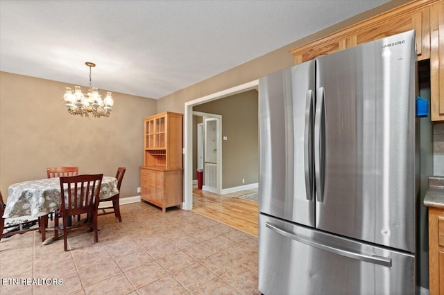 142 Wagon Wheel Ln, Pioneer, TN 37847 - dining area featuring a chandelier and light tile patterned floors