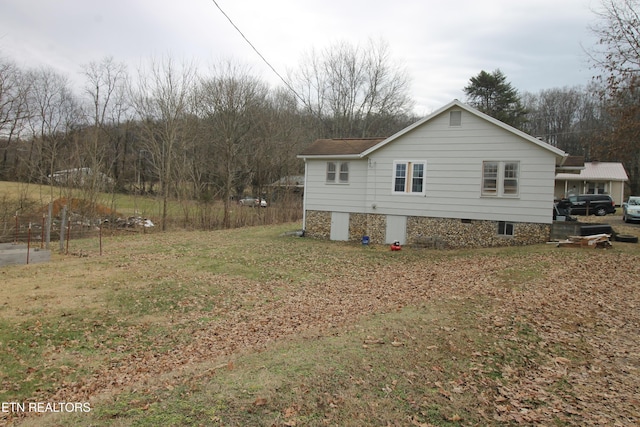 view of property exterior with a lawn