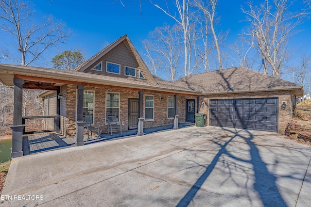 view of front facade with a garage and a porch