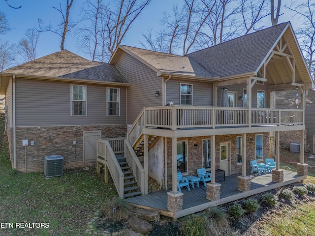 back of house featuring a wooden deck, central AC unit, and a patio