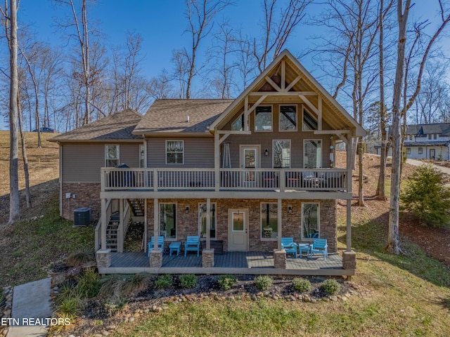 rear view of property featuring a deck