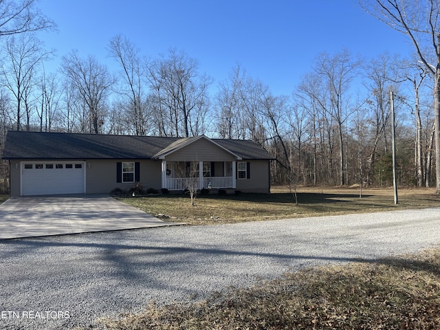 view of front of property with a garage and covered porch