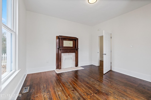 112 E Inskip Dr, Knoxville, TN 37912 - empty room with healthy amount of natural light, dark wood-style floors, and baseboards