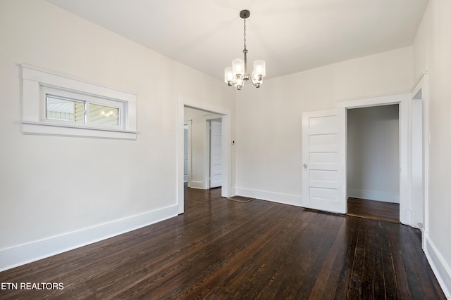 112 E Inskip Dr, Knoxville, TN 37912 - unfurnished dining area with a chandelier, dark wood-style flooring, and baseboards