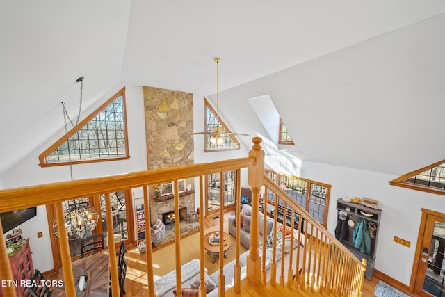 interior space with hardwood / wood-style floors, vaulted ceiling with skylight, and ceiling fan