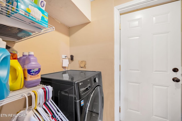 washroom with washer and dryer