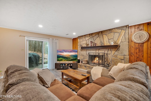 living room featuring a fireplace and light hardwood / wood-style floors