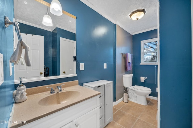 bathroom featuring tile patterned flooring, ornamental molding, vanity, toilet, and a textured ceiling